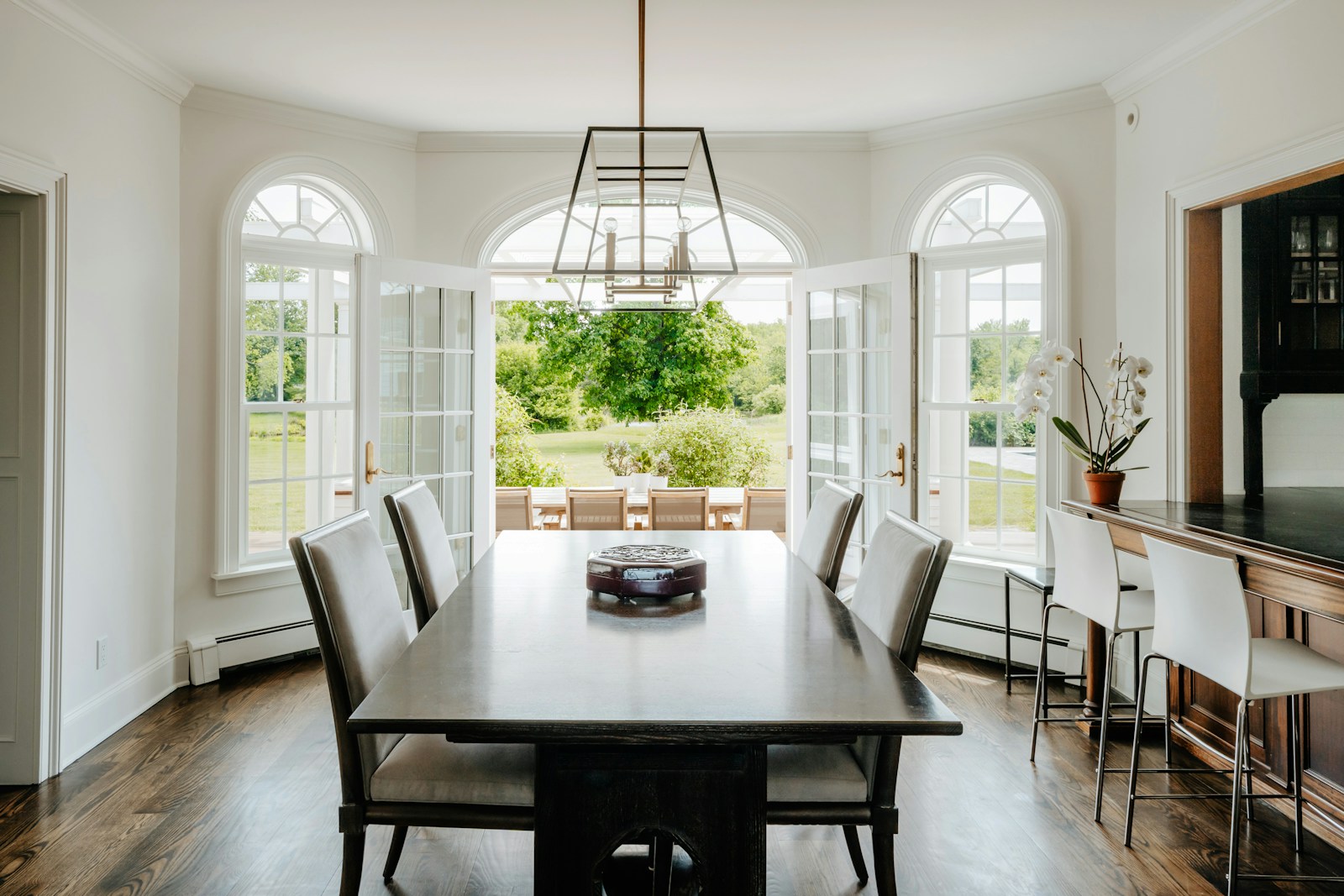 a dining room with a table and chairs